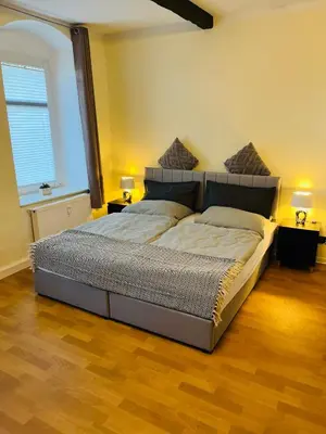 Ein Bett oder Betten in einem Zimmer der Unterkunft Apartment tenX Mittweida