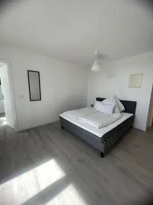 Ein Bett oder Betten in einem Zimmer der Unterkunft Cozy Work and Stay Pretty Home