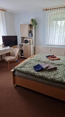 Ein Bett oder Betten in einem Zimmer der Unterkunft Pension Glück Auf