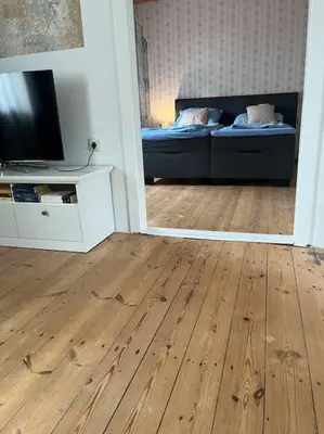 Ein Bett oder Betten in einem Zimmer der Unterkunft Rosa Schwarz
