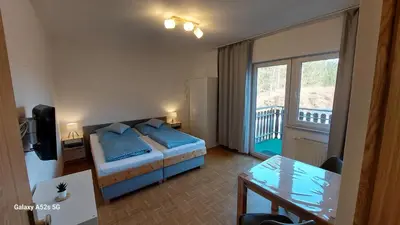 Ein Bett oder Betten in einem Zimmer der Unterkunft Gästehaus Bergwald