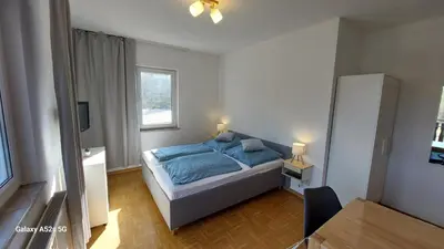Ein Bett oder Betten in einem Zimmer der Unterkunft Gästehaus Bergwald
