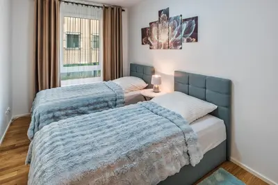 Ein Bett oder Betten in einem Zimmer der Unterkunft Apartment am Großen Garten - Terrasse & Parkplatz -8 Personen