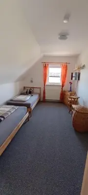 Ein Bett oder Betten in einem Zimmer der Unterkunft Ferienwohnung Gentsch in Schmannewitz