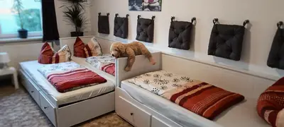 Ein Bett oder Betten in einem Zimmer der Unterkunft Ferienwohnung Gentsch in Schmannewitz