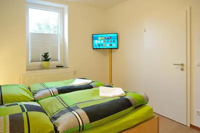 Ein Bett oder Betten in einem Zimmer der Unterkunft Lausitzer Ferienapartment Suite