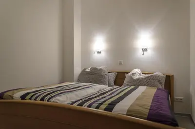 Ein Bett oder Betten in einem Zimmer der Unterkunft Ferienwohnung Radebeul Gerlach