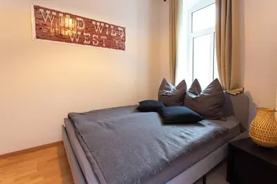 Ein Bett oder Betten in einem Zimmer der Unterkunft Pretty Home Wild West Zentrum