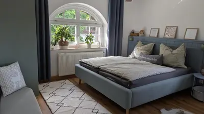 Ein Bett oder Betten in einem Zimmer der Unterkunft Ferienwohnung Sorgenfrei