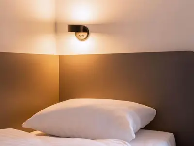 Ein Bett oder Betten in einem Zimmer der Unterkunft B&B HOTEL Dresden City-Süd