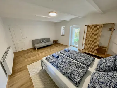 Ein Bett oder Betten in einem Zimmer der Unterkunft Niemtscher Lodge am See