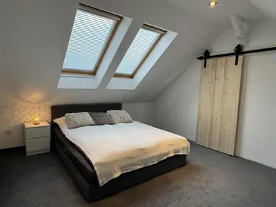 Ein Bett oder Betten in einem Zimmer der Unterkunft NEU! Ferienhaus Sanja