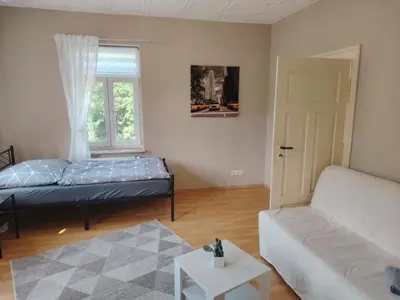 Ein Bett oder Betten in einem Zimmer der Unterkunft Ruhige Auszeit mit zentraler Anbindung