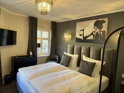 Ein Bett oder Betten in einem Zimmer der Unterkunft Apartmenthaus Burkhardt