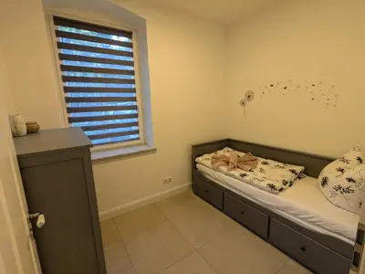 Ein Bett oder Betten in einem Zimmer der Unterkunft Ferienwohnung 
