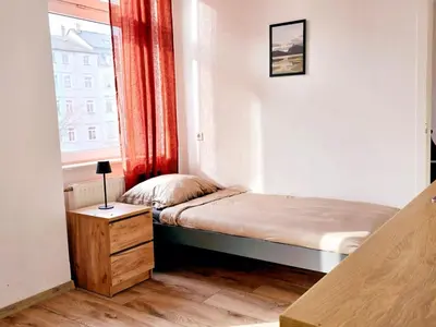Ein Bett oder Betten in einem Zimmer der Unterkunft Hotel New Town