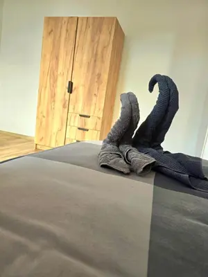 Ein Bett oder Betten in einem Zimmer der Unterkunft Hotel New Town