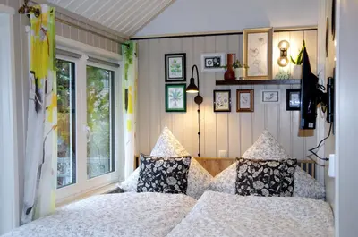 Ein Bett oder Betten in einem Zimmer der Unterkunft Ferienhaus Tinylausitz mit Kamin und Sauna