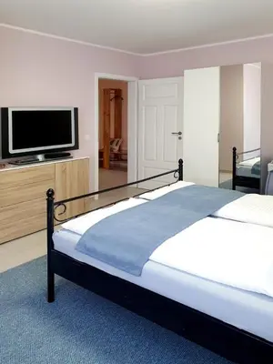 Ein Bett oder Betten in einem Zimmer der Unterkunft Grossenhain Ferien