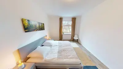 Ein Bett oder Betten in einem Zimmer der Unterkunft 3-Raum-Appartement im Stadtteil Kapellenberg, WLAN