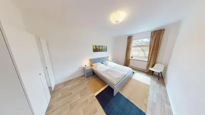 Ein Bett oder Betten in einem Zimmer der Unterkunft 3-Raum-Appartement im Stadtteil Kapellenberg, WLAN