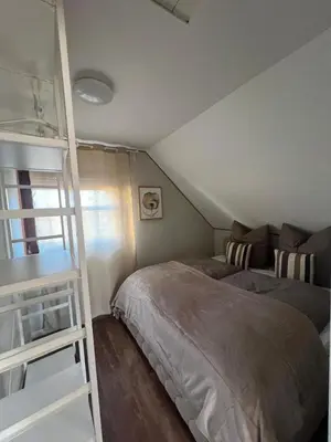 Ein Bett oder Betten in einem Zimmer der Unterkunft Zur Blume