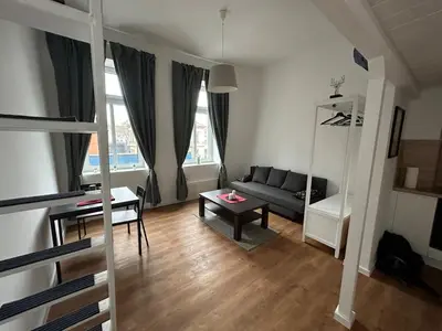 Ein Sitzbereich in der Unterkunft Gemütliche Wohnung mit Hochbett