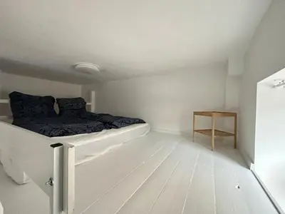 Ein Bett oder Betten in einem Zimmer der Unterkunft Gemütliche Wohnung mit Hochbett