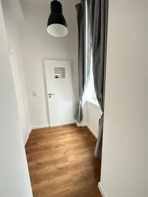 Ein Bett oder Betten in einem Zimmer der Unterkunft Gemütliche Wohnung mit Hochbett