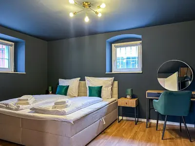 Ein Bett oder Betten in einem Zimmer der Unterkunft Westpromenade No 6