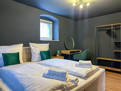 Ein Bett oder Betten in einem Zimmer der Unterkunft Westpromenade No 6