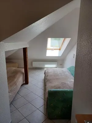 Ein Bett oder Betten in einem Zimmer der Unterkunft Ferienwohnung Gartenblick