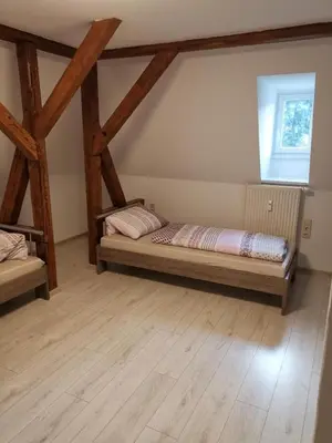 Ein Bett oder Betten in einem Zimmer der Unterkunft Ferienwohnung Rote-Villa