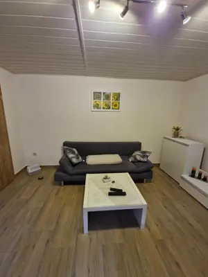 Ein Sitzbereich in der Unterkunft Ferienwohnung Weigl