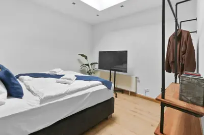 Ein Bett oder Betten in einem Zimmer der Unterkunft Hochwertiger ausgestatteter Bungalow für 8 Personen, 3 Schlafzimmer, 2 Parkplätze, WLAN