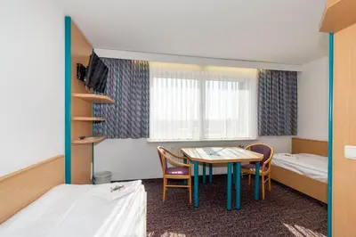 Ein Bett oder Betten in einem Zimmer der Unterkunft Gästehaus im Haus des Kfz-Gewerbes
