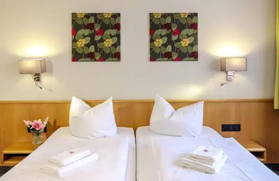 Ein Bett oder Betten in einem Zimmer der Unterkunft Flair Hotel Kamenz