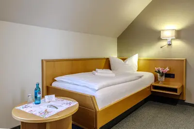 Ein Bett oder Betten in einem Zimmer der Unterkunft Flair Hotel Kamenz