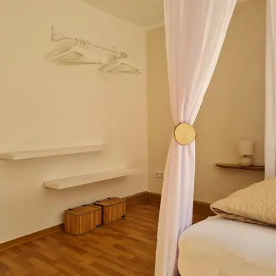 Ein Bett oder Betten in einem Zimmer der Unterkunft Ferienwohnung Liliensteinblick am Elberadweg