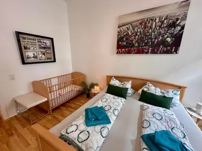 Ein Bett oder Betten in einem Zimmer der Unterkunft Altstadt Suite 120qm WLAN Balkon 2 Bäder