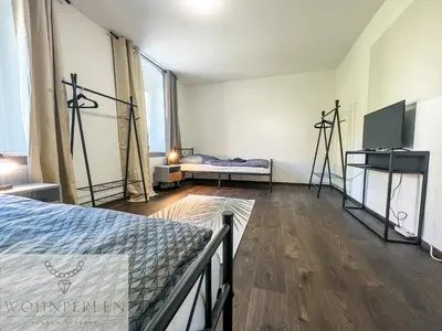 Ein Bett oder Betten in einem Zimmer der Unterkunft MonteurWohnung Wilsdruff App 2