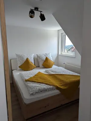 Ein Bett oder Betten in einem Zimmer der Unterkunft Ferienwohnung Alte Bäckerei