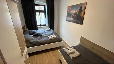 Ein Bett oder Betten in einem Zimmer der Unterkunft FeWo Blick zum Lulatsch