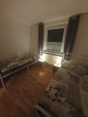 Ein Bett oder Betten in einem Zimmer der Unterkunft Ferienwohnung zur Sonne