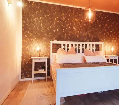 Ein Bett oder Betten in einem Zimmer der Unterkunft Ferienwohnung Pension Reimann Zwethau