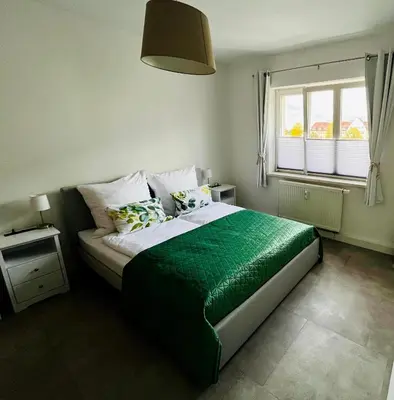Ein Bett oder Betten in einem Zimmer der Unterkunft Gemütliche, ruhige Wohnung in zentraler Lage