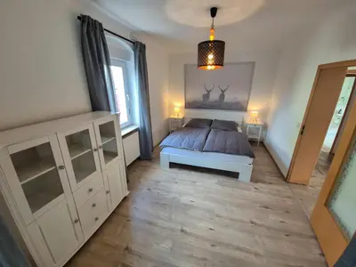Ein Bett oder Betten in einem Zimmer der Unterkunft Villa Waldzauber