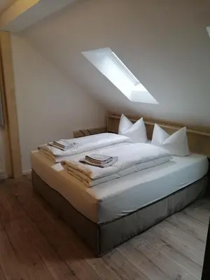 Ein Bett oder Betten in einem Zimmer der Unterkunft Gasthaus Pension Bretthäusl