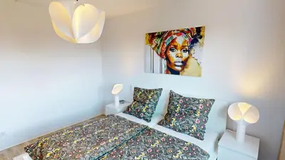 Ein Bett oder Betten in einem Zimmer der Unterkunft Wohnen ohne Hindernisse, nur 170m bis zur Haltestelle der Linie 5, WLAN