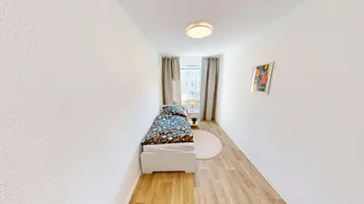 Ein Bett oder Betten in einem Zimmer der Unterkunft Cozy Apartment with balcony, WLAN